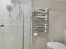 A bathroom with a shower and toilet at Juniper Cottage 