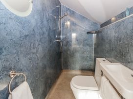 A bathroom with shower, toilet and sink at Awelon Y Mor in Aberaeron