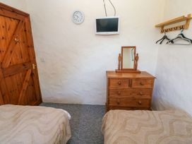 A bedroom with two beds and a dresser at Casa Mia Goodwick