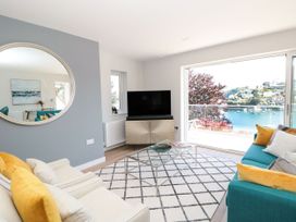 A living room with a sofa and a television at Galvayne in Dartmouth