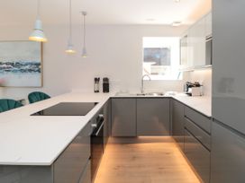 A kitchen with modern appliances and a sink at Galvayne in Dartmouth