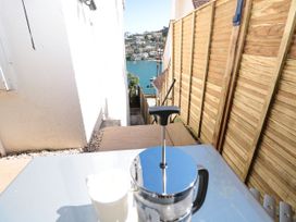 A coffee maker and cup overlooking water at Galvayne Dartmouth