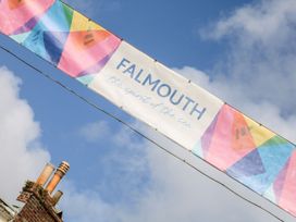 A banner with the text Falmouth the spirit of the sea outdoors at The Old Byre in Falmouth