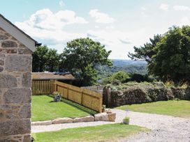 An outdoor area with a house and garden at The Forge in Falmouth