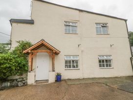A house with a front door and windows at Cottage No 9 in Keswick