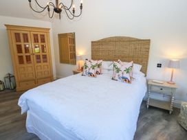 A bedroom with a bed and wardrobe at The Summerhouse in 