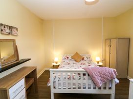 A bedroom with a bed and a dresser at Thadg and Hannah’s in Miltown
