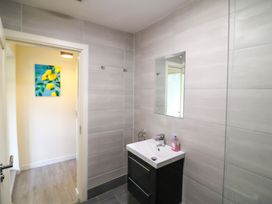 A bathroom with a sink and mirror at Thadg and Hannah’s in Miltown