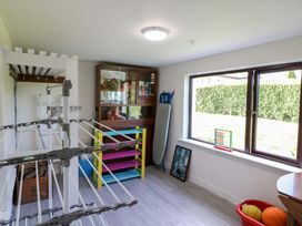 A snug with a drying rack and colorful shelf at Thadg and Hannah’s in Miltown