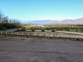 A view from a viewpoint overlooking a river and mountains at Thadg and Hannah’s in Miltown