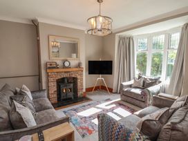 A living room with a fireplace and television at 44 Love Lane, Whitby