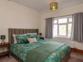 A bedroom with a bed and bedside tables at 44 Love Lane in Whitby