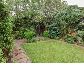 A garden with plants and grass at 44 Love Lane in Whitby
