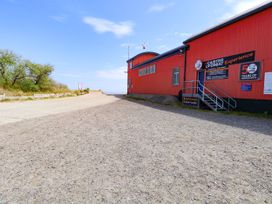 An entrance to Caister Lifeboat Experience with a path at Mabby Great Yarmouth
