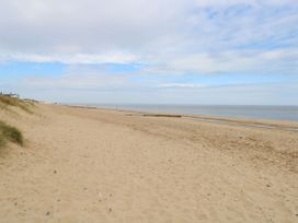 A beach with sand and water at Mabby in Great Yarmouth