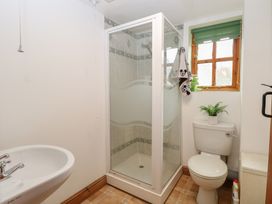 A bathroom with a shower and toilet at Mabby in Caister-On-Sea