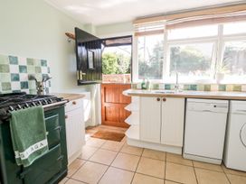 A kitchen with a sink and dishwasher at Yewbarrow Seascale