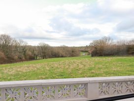 A view of a field and trees at The Bungalow in St. Austell
