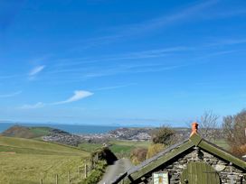 A view of hills and ocean from a road near Penpegws near Aberystwyth