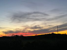 A sunset with clouds and hills at Penpegws near Aberystwyth