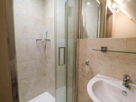 A bathroom with a shower and sink at Cliff Cottage
