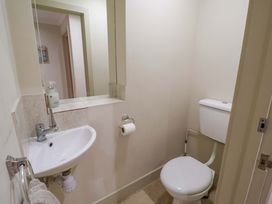A bathroom with a sink and a toilet at Cliff Cottage