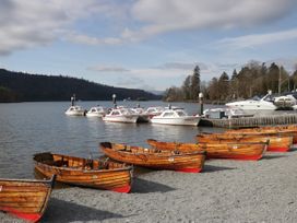 Rowboats and motorboats on water at 8 Railway Cottages in Ulverston
