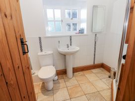 A bathroom with a toilet and sink at Swallows Rest in Hexham