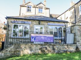 A visitor information building with a sign at The Market Place in Hexham