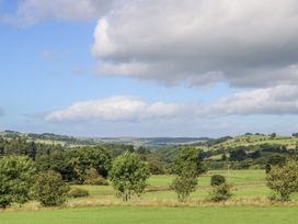 A landscape with trees and hills at Swallows Rest in Hexham