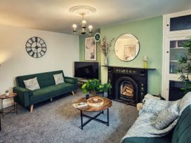 A living room with a sofa and coffee table at 20 Bridge Street in Morpeth