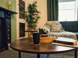 A living room with a coffee table and sofa at 20 Bridge Street Morpeth