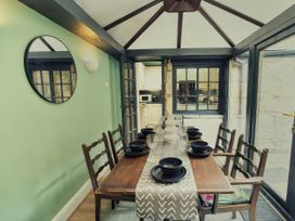 A dining room with a table and chairs at 20 Bridge Street in Morpeth