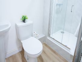 A bathroom with a toilet, sink, and shower at 20 Bridge Street in Morpeth