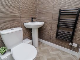 A bathroom with a sink and toilet at 16 The Viking in Seahouses