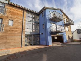 An exterior view of a multi-story building with balconies at 16 The Viking Seahouses