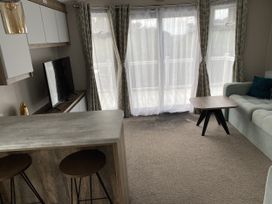 A living room with a television and a sofa at WW15 Plot in Newquay