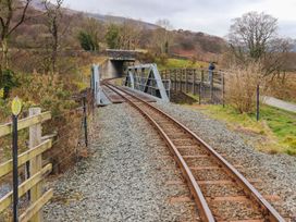 A railway track near a bridge in a rural area at Llys Elen, Caernarfon