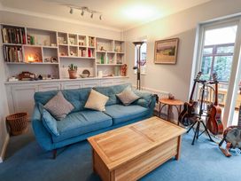 A living room with a sofa and coffee table at 17 Demesne Gardens in Ipswich