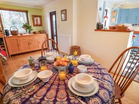 A dining room with a table set for breakfast at 17 Demesne Gardens Ipswich