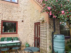 An outdoor area with a table and chairs at 17 Demesne Gardens Ipswich