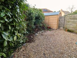 A garden with gravel and a wooden shed at 17 Demesne Gardens in Ipswich
