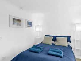 A bedroom with a bed and pillows at 40 Raleigh Court in Sherborne