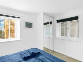 A bedroom with a bed and towels on it at 40 Raleigh Court Sherborne