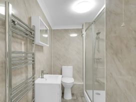 A bathroom with shower, toilet, and sink at 40 Raleigh Court in Sherborne
