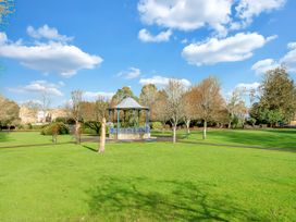 A park with a gazebo and trees at 40 Raleigh Court Sherborne