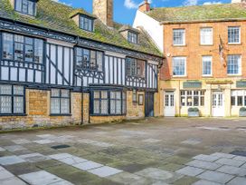 An outdoor area with historic buildings and a courtyard at 40 Raleigh Court Sherborne