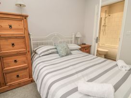 A bedroom with a bed and a chest of drawers at The Sea Chest in Alnmouth