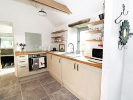 A kitchen with cabinets and appliances at Rhos Y Clegryn Goodwick