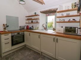 A kitchen with various appliances and utensils at Rhos Y Clegyrn Goodwick